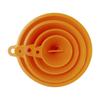Set of orange silicone measuring cups on a white background