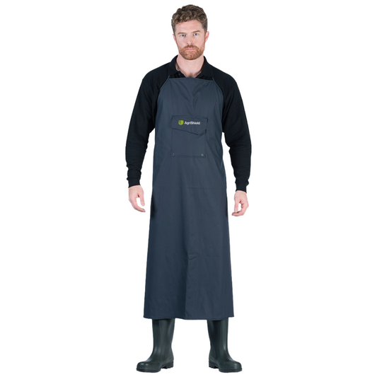 Man wearing a navy apron with a logo on a white background