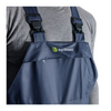 Blue overalls with AgriShield logo worn by a person, on a white background