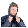 Man wearing a dark blue raincoat with the hood up on a white background