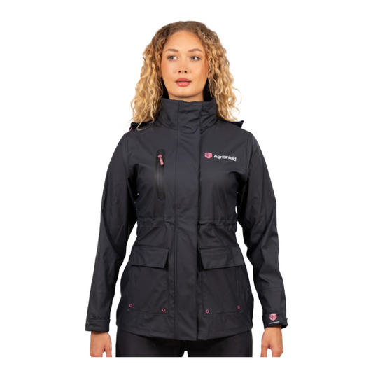 Woman wearing a navy jacket with visible branding on a white background