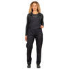 Woman wearing a black jumpsuit with a visible brand logo on a white background