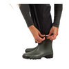 Person wearing green rubber boots on a white background