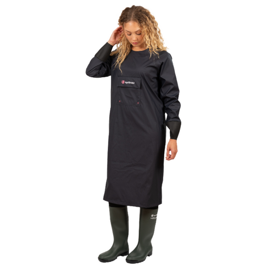 Person wearing a black apron with a visible brand logo on a white background