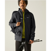 A man wearing a dark gray waterproof jacket over a lime green shirt, holding hiking poles and wearing a backpack, photographed against a light gray studio background.