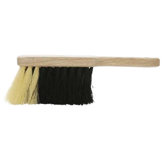 Cleaning brush with wooden handle and black and yellow bristles on a white background