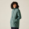 Person wearing a teal raincoat on a plain background