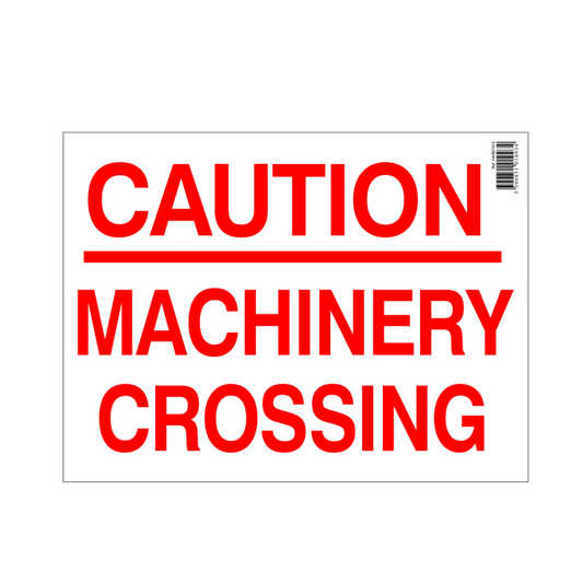 Caution machinery crossing sign with red text on a white background
