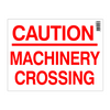 Caution machinery crossing sign with red text on a white background