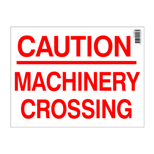Caution machinery crossing sign with red text on a white background