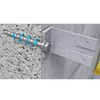 A close-up product rendering of a metal wall anchor bolt with a bracket attached to a light gray textured wall, with a separate inset showing the threaded bolt in concrete and a blue arrow indicating installation direction.