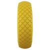 Yellow tire with tread pattern on a white background