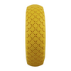 Yellow tire with tread pattern on a white background