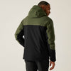 Person wearing a green and black jacket on a white background