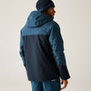 Person wearing a two-tone blue jacket and beanie on a plain background