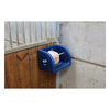 Blue animal feed or water bowl in a stable setting