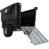 A black plastic dump trailer with a metal ramp extended, shown on a plain white background. The side of the trailer features a blue and white logo.