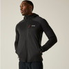 A man wearing a black hooded athletic jacket with orange zipper accents and a white logo on the chest, photographed against a plain light beige studio background.
