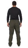 Man wearing a black long-sleeve shirt and green pants on a white background
