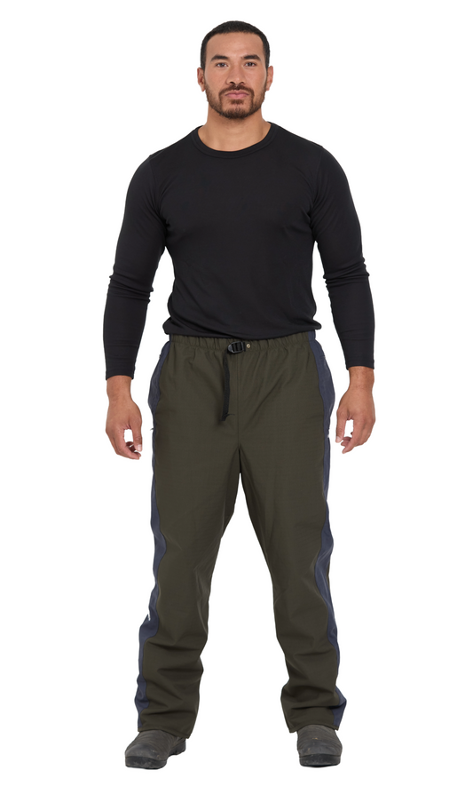 Man wearing a black long-sleeve shirt and dark pants on a white background