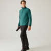 a man wearing a green fleece, black pants and shoes, facing to the right