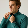 close up of a man wearing a fleece green with a black watch on his wrist on an offwhite background