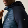 Person wearing a blue puffer vest and black hoodie with visible brand logos.