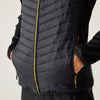 Black puffer vest with yellow zipper on a neutral background