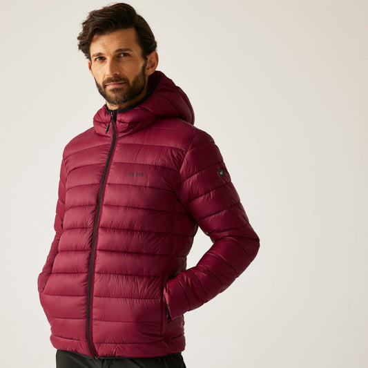 Man wearing a red puffer jacket on a light gray background