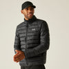 Man wearing a black puffer jacket with a visible brand logo on a plain background