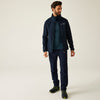 Man wearing a navy jacket and pants with a white background
