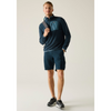 A man modeling a navy blue quarter-zip fleece pullover with a contrasting light blue chest pocket, paired with matching navy shorts and black running shoes, against a light beige studio background.