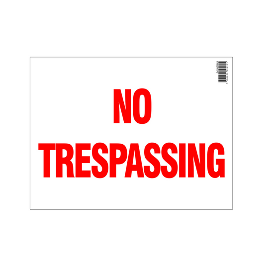 No Trespassing sign with red text on a white background