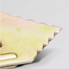 A close-up anchor edge with a scalloped wavy edge, shown against a light gray background.