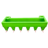 Green plastic feed trough on a white background