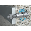 A silver metal wall anchor bolt with a wing nut and threaded rod shown mounted against a textured concrete wall, with a blue circular graphic highlighting the anchor.