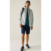 A man modeling a light gray lightweight hooded jacket, navy blue shorts, a teal t-shirt, a navy cap, and black sneakers against a plain light beige studio background.