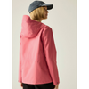 A woman shown from the back wearing a pink hooded jacket and a dark blue baseball cap against a plain light beige studio background.