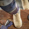 someone taking a step up while wearing boots on step