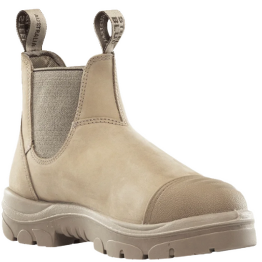 A single beige Chelsea-style boot with elastic side panels, pull tabs, and a chunky lug sole, shown on a plain white background.