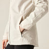 Beige jacket with a zipper pocket on a neutral background