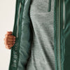 Close-up of a person wearing a green jacket with a zipper, showing brand information on the sleeve.