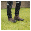 lifestyle image of the boots in a field 