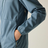 a close up of a blue jacket with a mans hand in the pocket