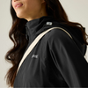 a woman wearing black regatta raincoat with cross body bag