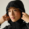 close up of concealed hood on woman in black raincoat