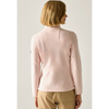 A woman with short blonde hair is shown from the back wearing a light pink long-sleeve mock-neck fleece jacket and tan pants against a light gray studio background.