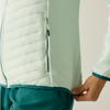 Close-up of a person wearing a ocean mist jacket 