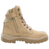 A beige tactical-style lace-up boot with purple laces, a side zipper, and a Steel Blue logo patch on the tongue, shown against a plain white background.