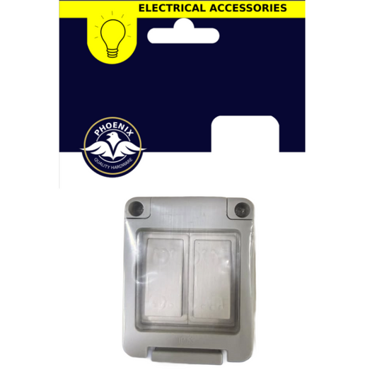 A double-gang switch socket cover with a clear protective cover and gray plastic frame, shown below its retail packaging card. The packaging features a dark navy blue background with a yellow 'ELECTRICAL ACCESSORIES' banner and a circular 'PHOENIX' logo.